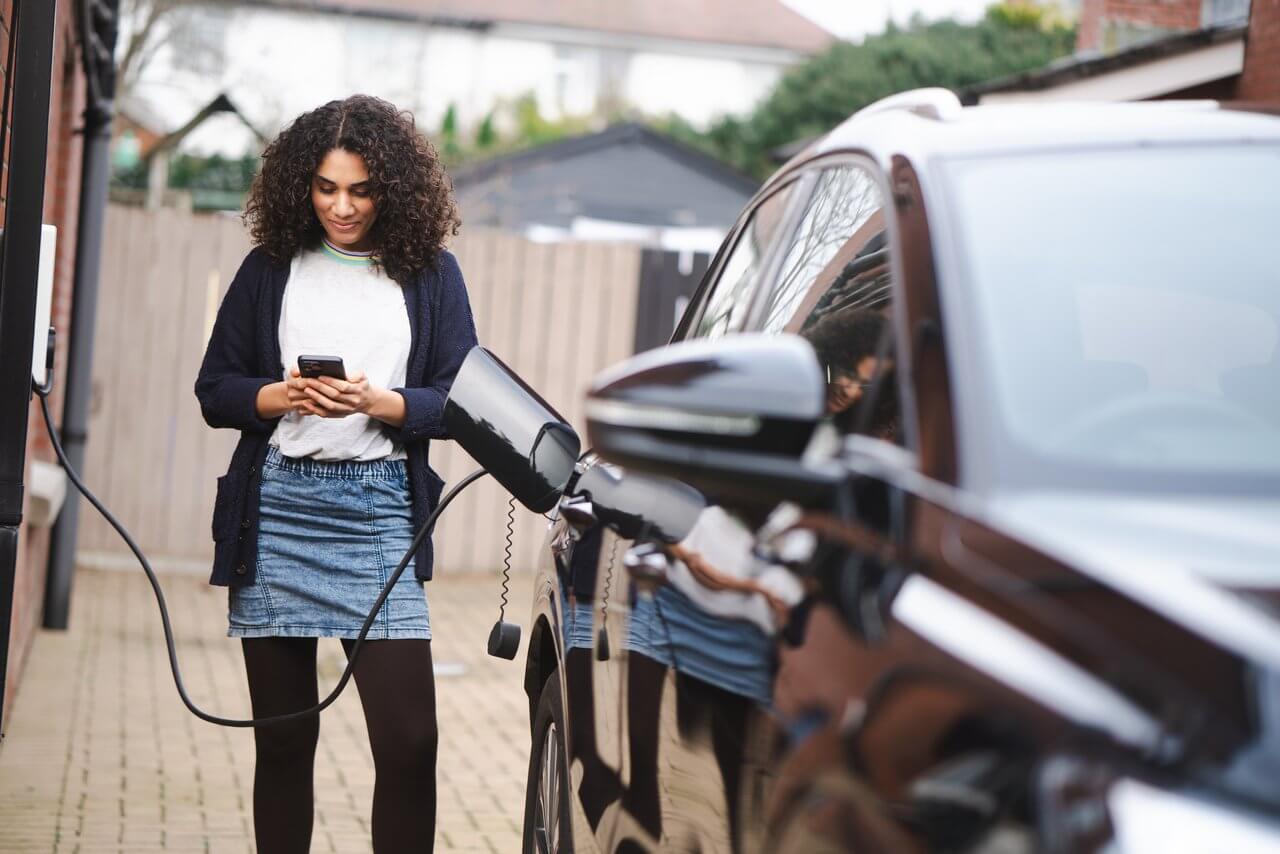 Woman charging her EV