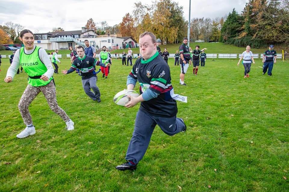DLSP rugby player with running with rugby ball playing a match