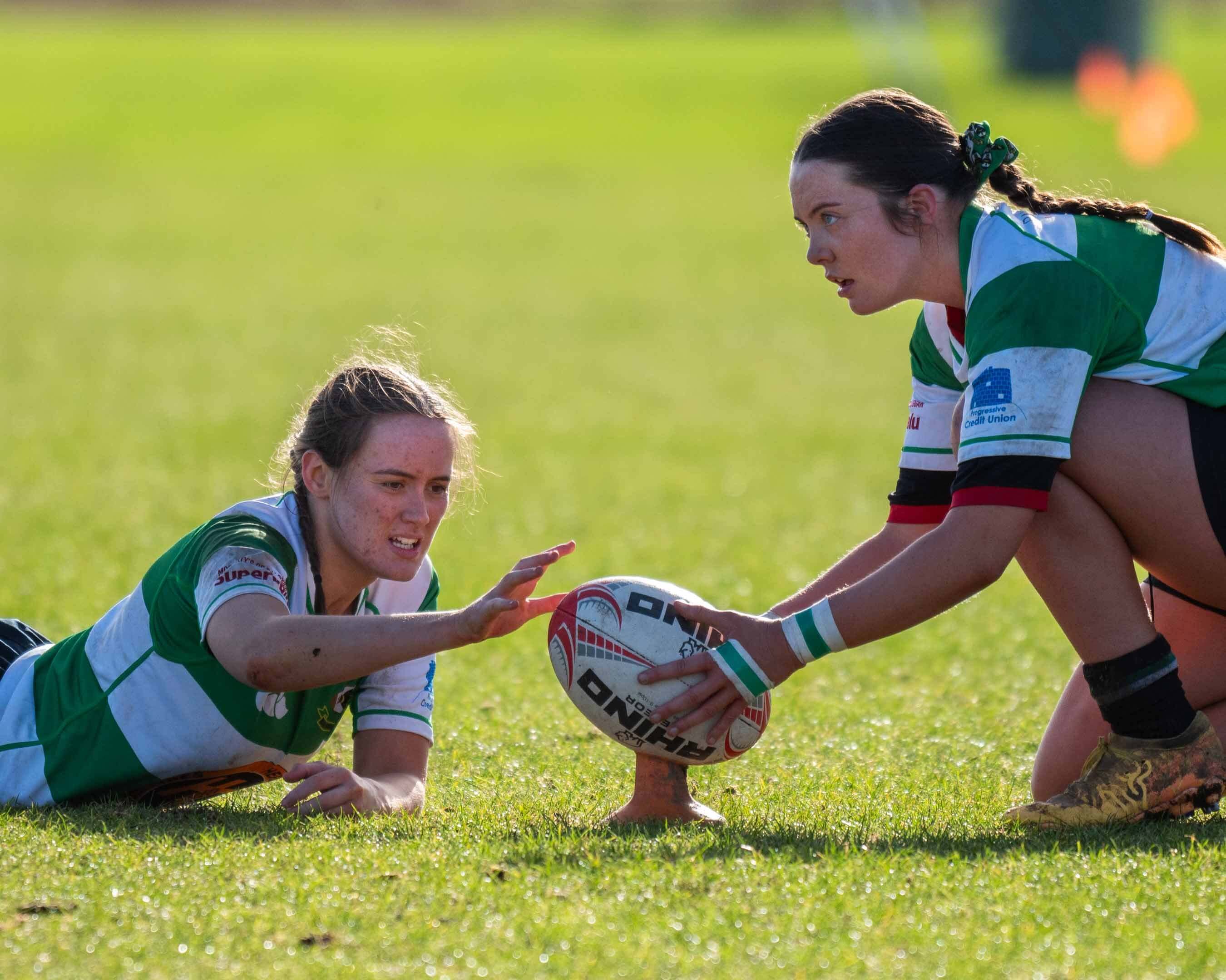 Balbriggan player setting the rugby ball for a kick