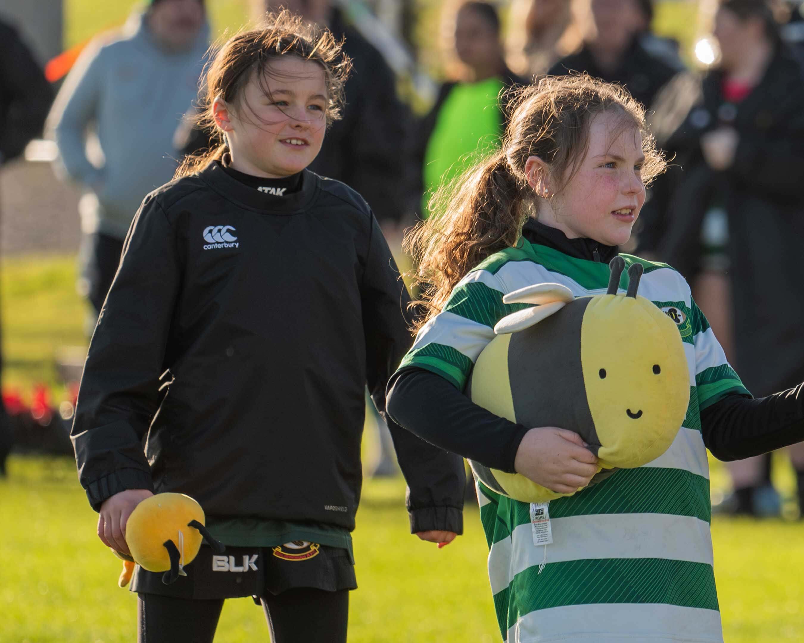 Sophie holding a bumble bee teddy
