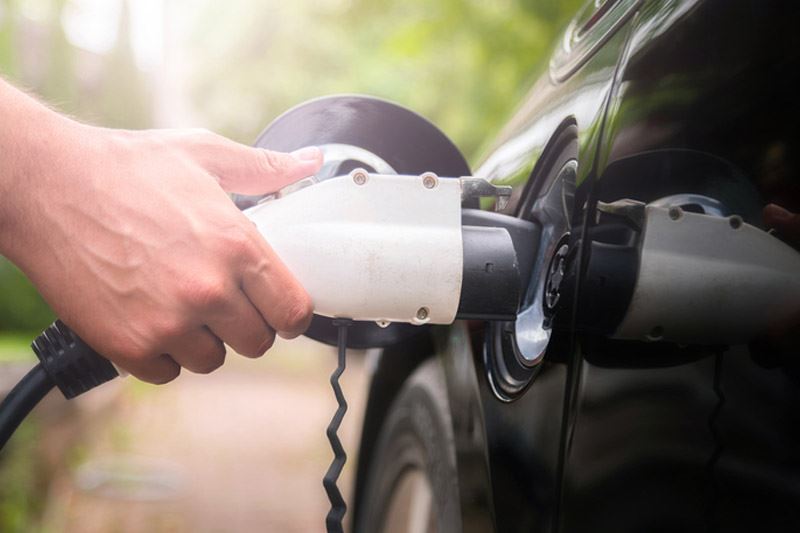 Man plugging in car