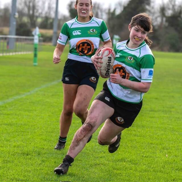 Balbriggan womens player running for a try
